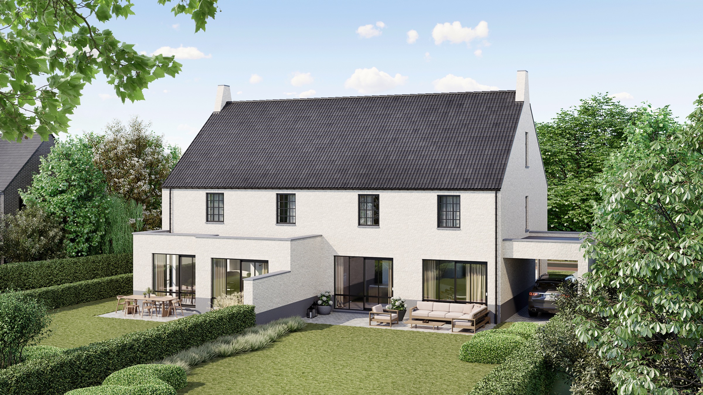 Garden side of white new homes with a dark pitched roof, terraces and gardens in Meeuwen.