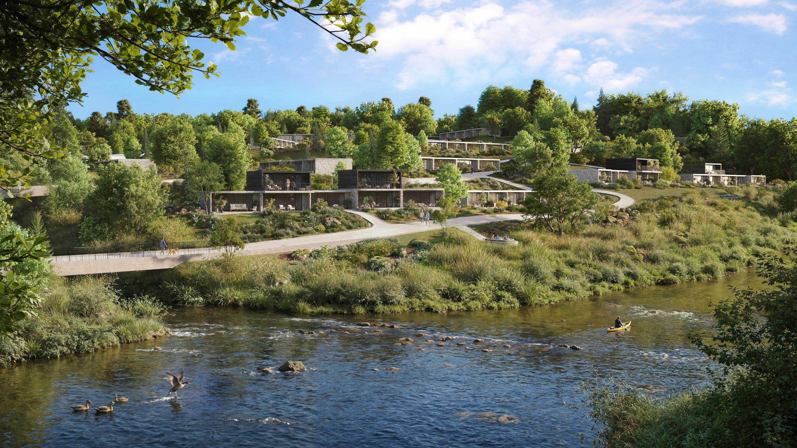 Summer view of the riverside lodges in Florenville