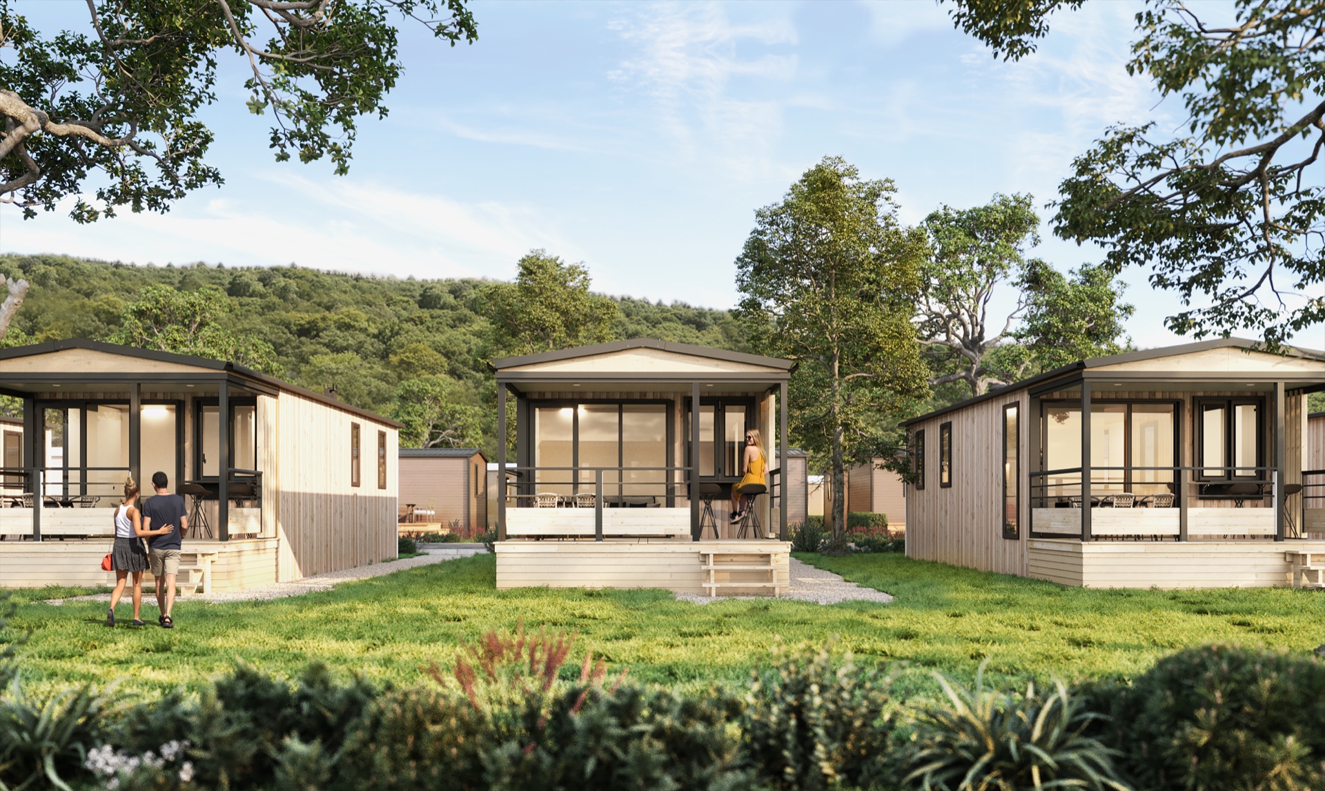 Rochehaut Premium Lodge with timber terraces and people